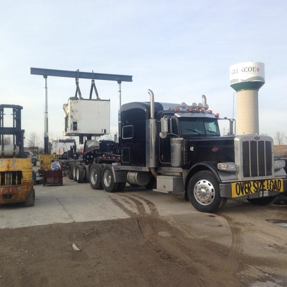 Husky Machinery Movers team in action - Professional heavy equipment moving and rigging services in Ontario